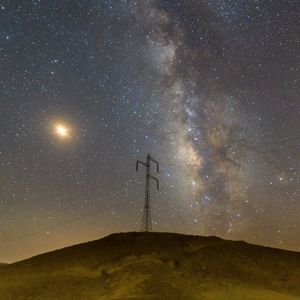 Scenic view of star field against sky at night