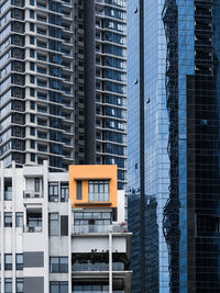 Low angle view of modern residential buildings in city