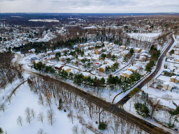 High angle view of snow covered buildings against sky