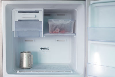 Close-up of container in refrigerator at home