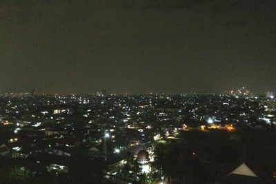 High angle shot of illuminated cityscape at night