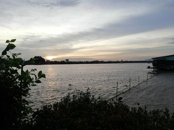 Scenic view of lake against sky during sunset