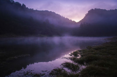 Scenic view of lake against sky during sunset