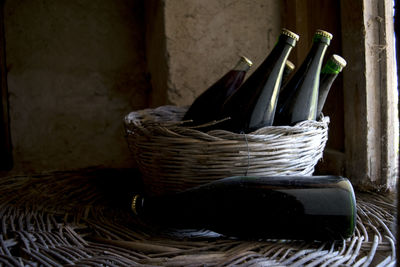 Close-up of bottles in basket