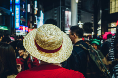 Rear view of people in city