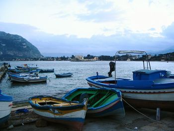 Boats moored at harbor