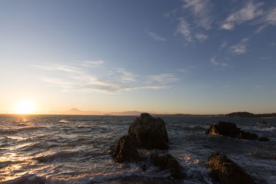 Scenic view of sea against sky during sunset