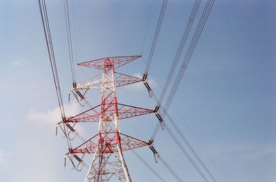 Low angle view of power lines against sky