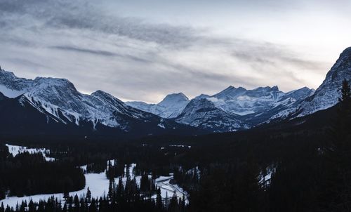 Scenic view of snowcapped mountains against sky during winter