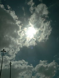 Low angle view of telephone pole against sky