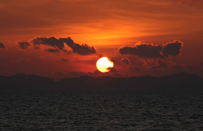 Scenic view of sea against romantic sky at sunset