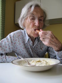 Portrait of woman eating food