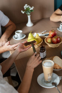 Midsection of woman preparing food on table