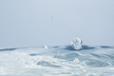 Close-up of water splashing against white background