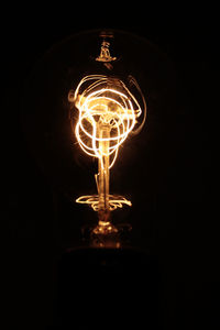 Low angle view of illuminated light bulb