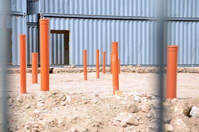 Close-up of metal pipe on sand