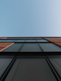 Directly below shot of building against clear sky