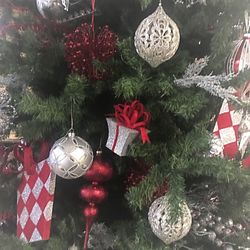 Close-up of christmas decorations hanging on tree at home