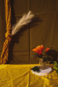 Close-up of flower vase on table at home