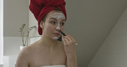 Portrait of young woman in bathroom