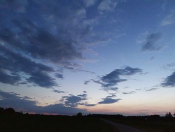 Scenic view of silhouette landscape against sky at sunset