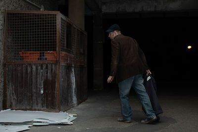 Rear view of man walking on street