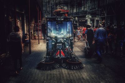 Rear view of people walking in bus