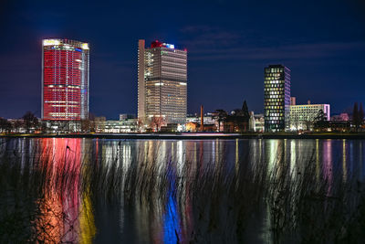 Illuminated buildings in city at night