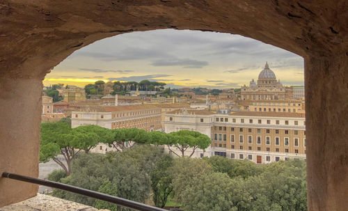 Buildings seen through arch window
