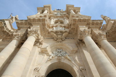 Low angle view of cattedrale at ortigia against sky