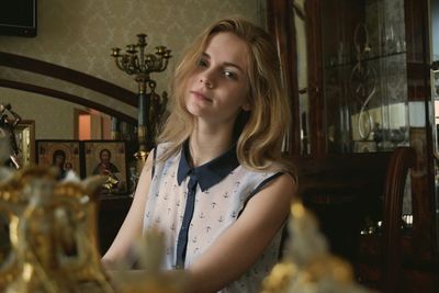 Portrait of beautiful woman sitting at home