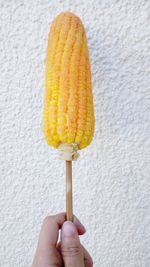 Close-up of hand holding ice cream