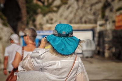 Rear view of a man with umbrella