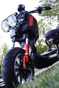 Close-up of bicycle parked on field