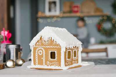 Christmas gingerbread house decorated with glaze
