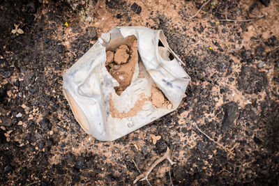 High angle view of garbage on paper