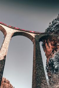 Low angle view of train on railway bridge