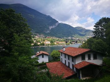 Houses on mountain against sky