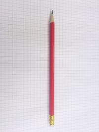 High angle view of pencil on lined paper