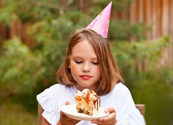 Portrait of girl holding ice cream