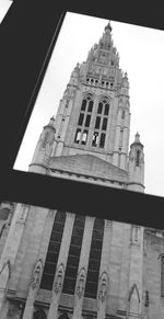 Low angle view of clock tower against sky