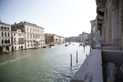 Canal passing through city buildings