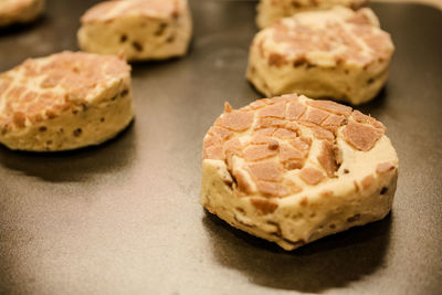 Delicious uncooked cinnamon roll on a pan