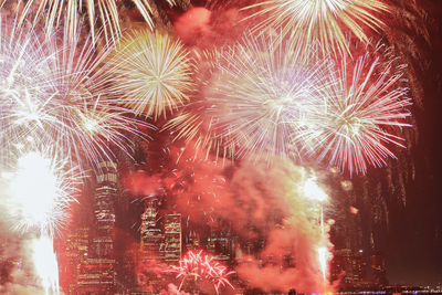 Low angle view of firework display at night