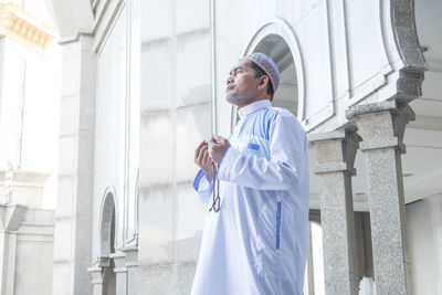 Low angle view of man standing in building