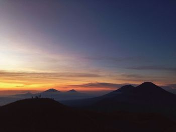 Scenic view of mountains at sunset
