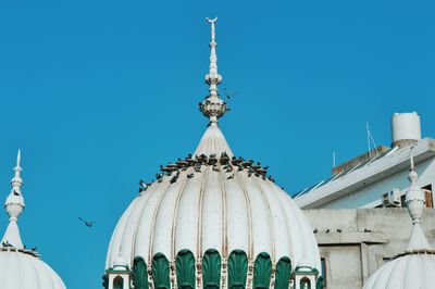 Low angle view of church against blue sky