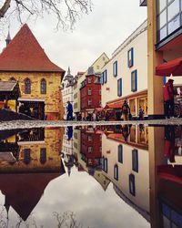 Buildings in city against sky