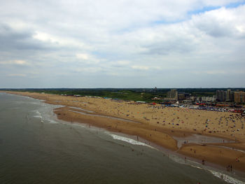 View of beach against cloudy sky