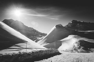 Snowdrifts lining the slopes leading to the back bowls in les arcs